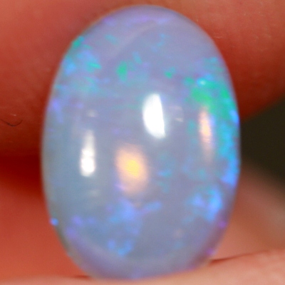 SOLID CRYSTAL OPAL Transparent with purple sparkles over a purple hue